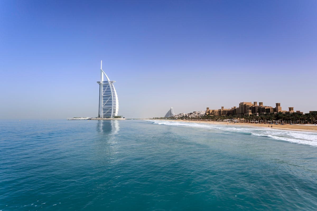 Dubai skyline with Burj Khalifa and modern architecture at golden sunset